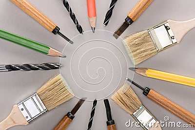 Top view of various paint brushes, pencils, chisels and drills Stock Photo