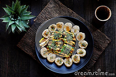 Top view vegan Vietnamese eating indoor restaurant, vegetarian rice rolls cut in slice with vegetable Stock Photo