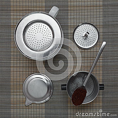 Top view of vietnamese coffee filter ingredients with ready cup of coffee on bamboo placemat Stock Photo