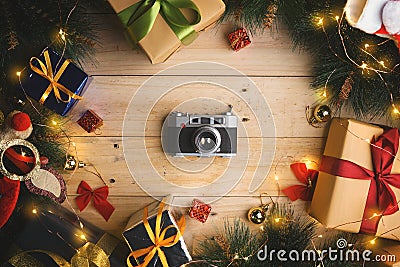 Top View of Vintage Camera Between Christmas Ornament on Wooden Stock Photo