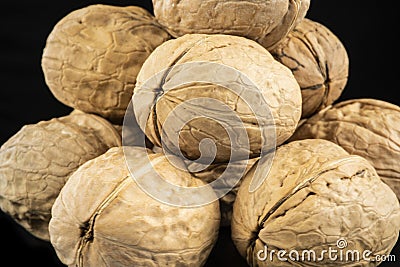 Top view walnut in shell isolated on black background Stock Photo