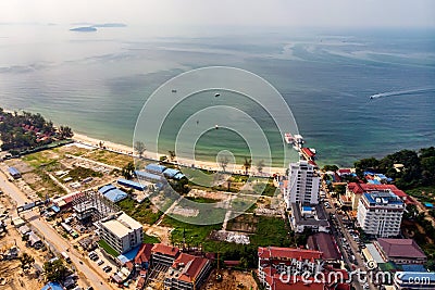 Top view of wasteland by the sea and buildings under construction in Sihanoukville, Cambodia Stock Photo