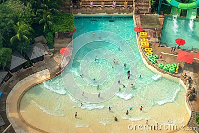 Top view of water park with many traveler have fun swimming pool in Sentosa, Singapore Editorial Stock Photo