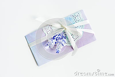 Top view of watercolor invitation with lace, flower and ribbon isolated on white Stock Photo