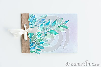 Top view of watercolor invitation with leaves and ribbon isolated on white Stock Photo