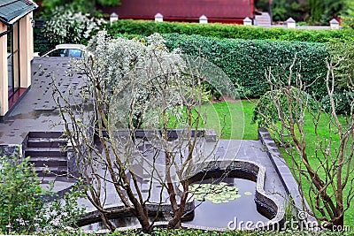 Top View On Well Cared Backyard With Patio And Pond Stock Photo