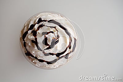 Top view of whipping cream with chocolate syrup on white background Stock Photo