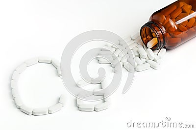 Top View Of White Calcium Pills Pouring Out Of Glass Bottle. Stock Photo