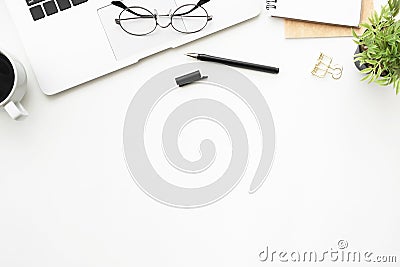 Top view of white office desk table with laptop computer and office supplies. Flay lay image Stock Photo