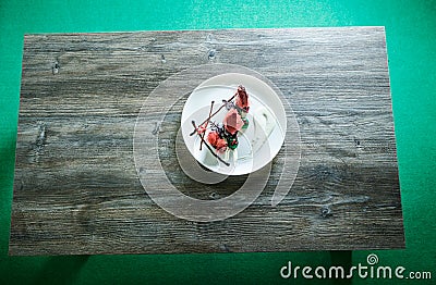 Top view on white restaurant plate with exquisite dessert Stock Photo