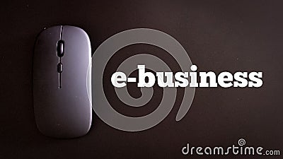 Top view wireless mouse with text e business isolated on black background. Stock Photo