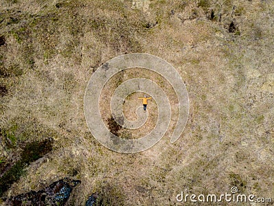 top view of woman lying on brown field with grass Stock Photo