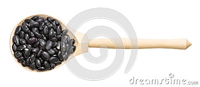 Top view of wood spoon with raw black turtle beans Stock Photo