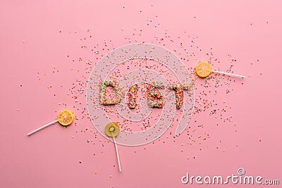 Top view of word diet made from candies on pink Stock Photo