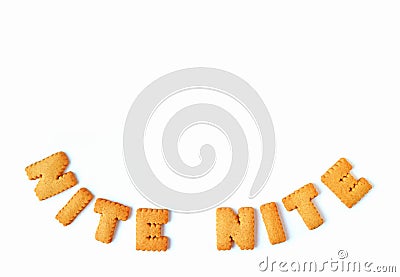 Top view of the word NITE NITE, made with alphabet shaped biscuits on white background, with free space for design Stock Photo