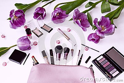 Bag for cosmetic brushes, decorative cosmetics and tulip flowers Stock Photo