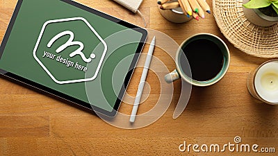 Workspace with mock up tablet, stylus pen, coffee mug and supplies Stock Photo