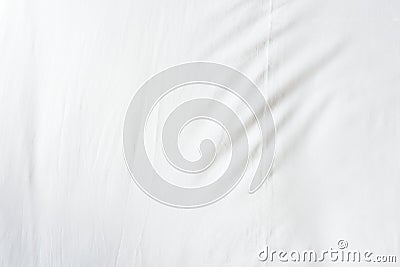 Top view of wrinkles on an unmade bed sheet after a long night sleep. Stock Photo