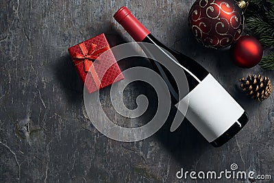 Top viiew of bottle of red wine with blank white label with Christmas decorations. Wine bottle Stock Photo