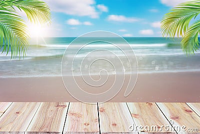 Top of wood table with blurred sea and coconut tree background Stock Photo