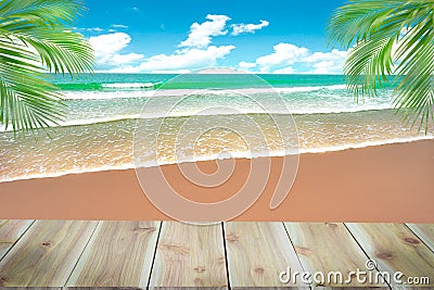 Top of wood table with blurred sea and coconut tree background - Stock Photo