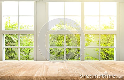 Top of wood table counter on blur window view garden background. Stock Photo