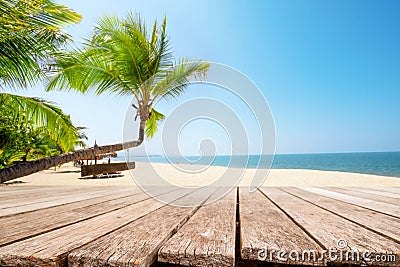 Top of wood table with seascape and palm tree Stock Photo