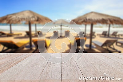 Top wooden table and blur of tropical beach background Stock Photo