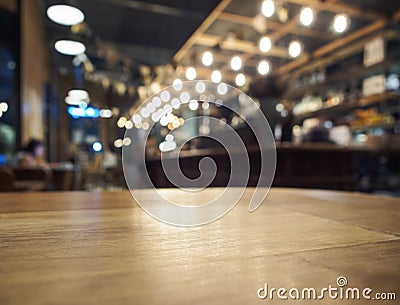 Top of Wooden table with Blurred Bar restaurant background Stock Photo