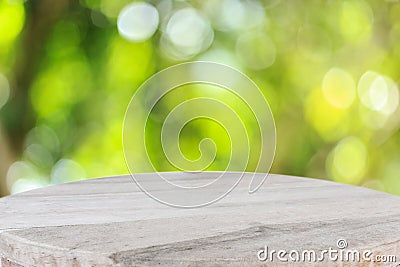 Top wooden table with sunny abstract green nature background, bl Stock Photo