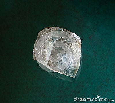Topaz gemstone mineral crystals in rock from Volodarsk Volynsky, Ukraine on green background. Geology websites, stone Editorial Stock Photo