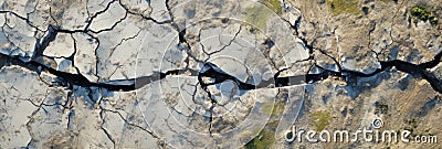 A Topdown View Of Ground Cracks Emphasizing Earthquakerelated Cracking Holes And The Textured Afterm Stock Photo