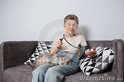 The topic is very old person and health problems. A senior Caucasian woman, 90 years old, with wrinkles and gray hair Stock Photo