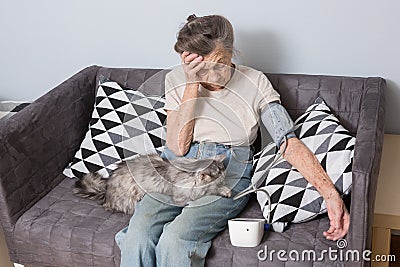 The topic is very old person and health problems. A senior Caucasian woman, 90 years old, with wrinkles and gray hair Stock Photo