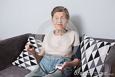 The topic is very old person and health problems. A senior Caucasian woman, 90 years old, with wrinkles and gray hair Stock Photo