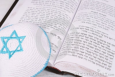 Close up view of torah with knitted kippah Stock Photo