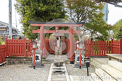 A Torii gateway, a traditional Japanese gate, found at the entrance of a Shinto Stock Photo