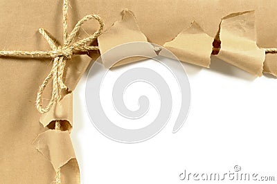 Torn brown paper parcel or package, white background, copy space Stock Photo