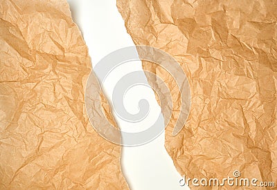 torn crumpled brown parchment paper, white background Stock Photo