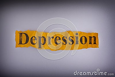 Torn crumpled piece of yellow paper with the word Depression Stock Photo