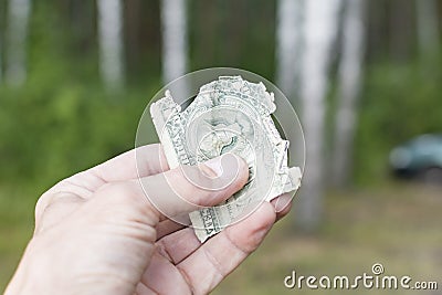 Torn half of a dollar bill in your hand Stock Photo