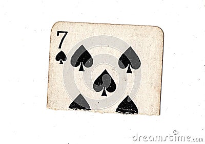 A torn half of a vintage seven of spades playing card. Stock Photo