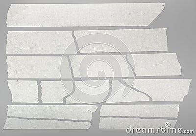 Torn masking tape pieces on gray background Stock Photo