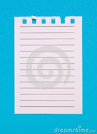 A torn page from a notebook on a blue vertical background Stock Photo