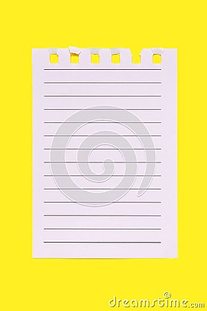 A torn page from a notebook on a yellow vertical background Stock Photo