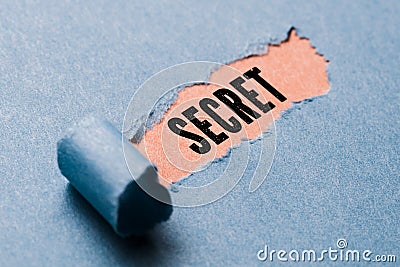 Torn paper revealing word `secret` Stock Photo