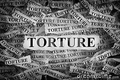 Torn pieces of paper with the word Torture Stock Photo