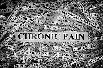 Torn pieces of paper with the words Chronic Pain Stock Photo