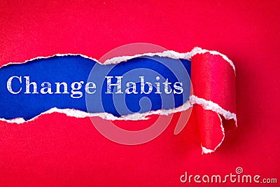 Torn red Paper and Change Habits text with a blue paper backgro Stock Photo