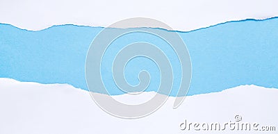 Torn white paper on blue background with space for text Stock Photo